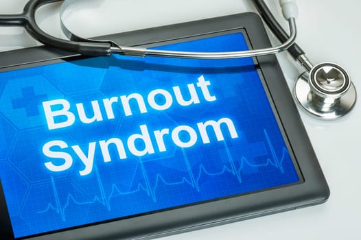 Tablet with the diagnosis burnout on the display