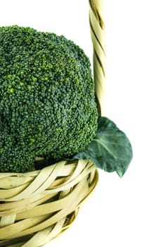Fresh broccoli in Straw basket on white background.