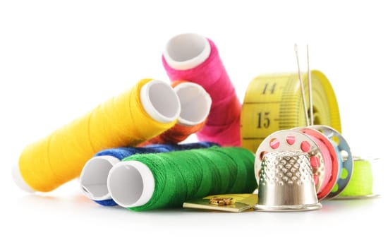 Composition with tailor needles and threads over white background