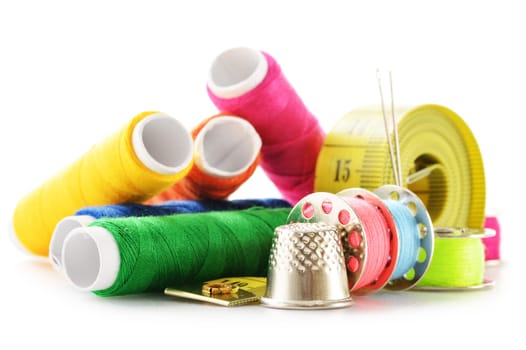 Composition with tailor needles and threads over white background
