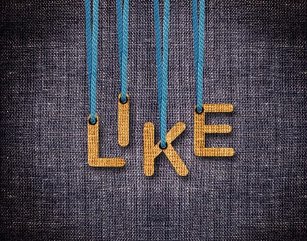 Like Letters hanging strings with blue sackcloth background.