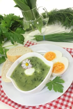 a green herb soup with eggs and creme Fraich