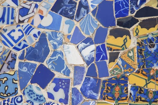 Detailed view of a ceramic mosaic-blue and yellow (Barcelona, ​​Catalunya, Spain)