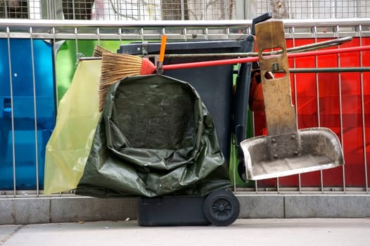 Photography of street cleaning utensils such as sweepers,brooms and shovels.