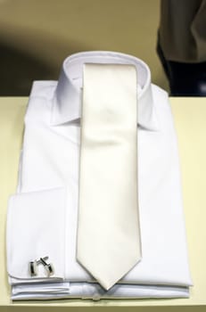 Photo of elegant white shirt and necktie, ceremony suit