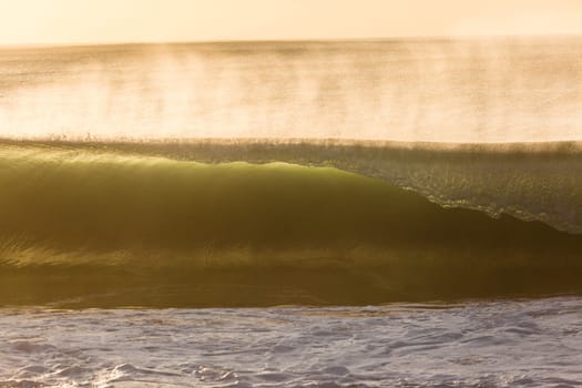 Ocean wave wall from storm swells crashing along shallow beach reef with natures  energy, a swimming photo of sea power.