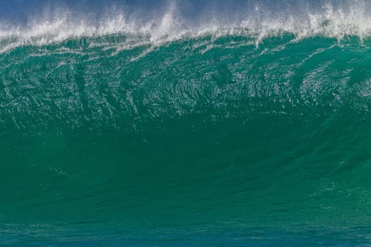 Ocean wave wall from storm swells crashing along shallow beach reef with natures  energy, a swimming photo of sea power.