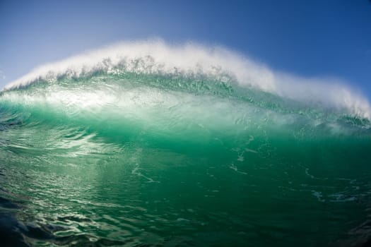 Ocean wave wall from storm swells crashing along shallow beach reef with natures  energy, a swimming photo of sea power.