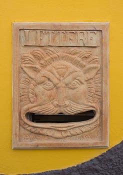 mailbox art. a ceramic face invites the postman to enter letters into her big mouth