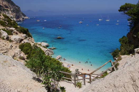Beach "Cala Goloritze"" in Sardinia. This beautiful bay is located on the eastern coast of Sardinia. It is accessible by boat or on foot via a path through the rugged mountains."