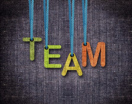Team Letters hanging strings with blue sackcloth background.