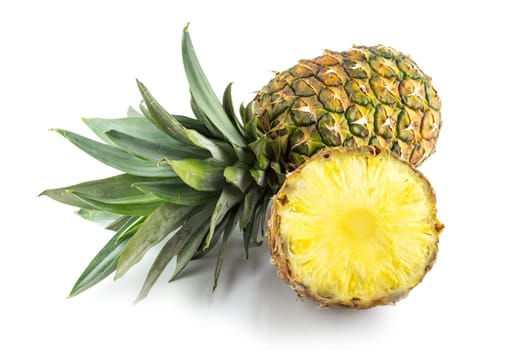 Ripe pineapple with slices isolated on white background