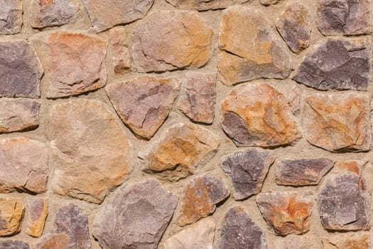 Stone wall section of raw materials used in building home for tough weather conditions and decor