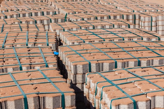 Bricks on palets for awaiting construction of road or paths