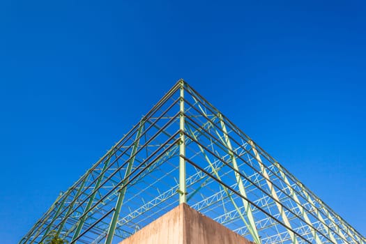 Steel frame warehouse building structure being put together piece by piece