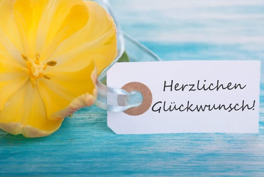 Label with the German Words Herzlichen Glueckwunsch which means Happy Birthday or Congratulations