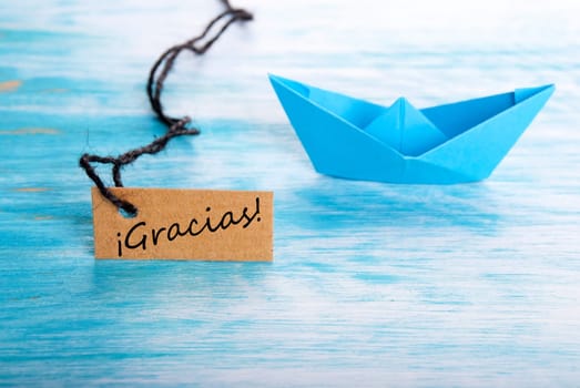 Label with the Spanish Word Gracias which means Thanks and a Boat