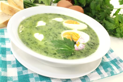 a green herb soup with eggs and creme Fraich