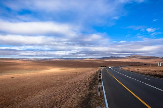 Road color scenic beauty contrast over rural countryside farming landscape