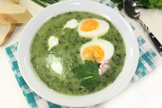 a green herb soup with eggs and creme Fraich