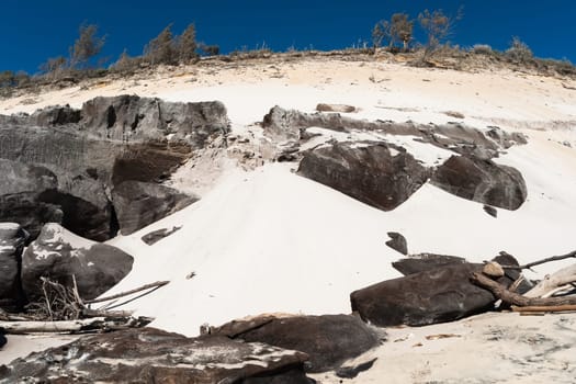Rainbow beach color sands and rocks alongside ocean sea embankment