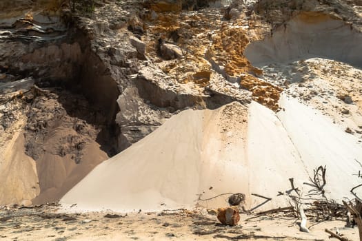Rainbow beach color sands and rocks alongside ocean sea embankment