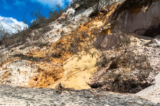 Rainbow beach color sands and rocks alongside ocean sea embankment