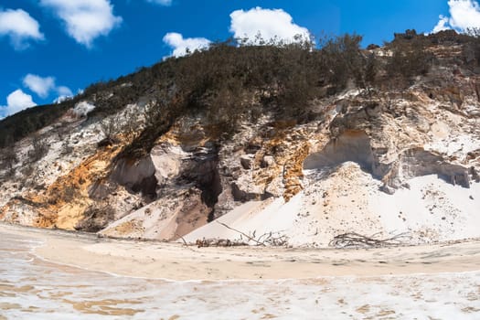 Rainbow beach color sands and rocks alongside ocean sea embankment