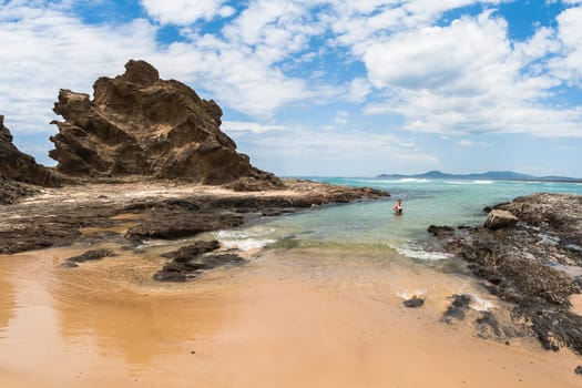 Rainbow beach color sands and rocks alongside ocean sea embankment