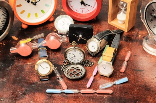 Many Different Clocks on a Woden Table