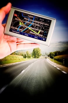 GPS Vehicle navigation system in a man hand.