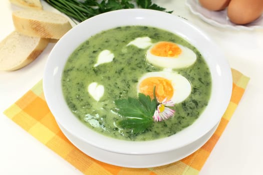 a green herb soup with eggs and creme Fraich