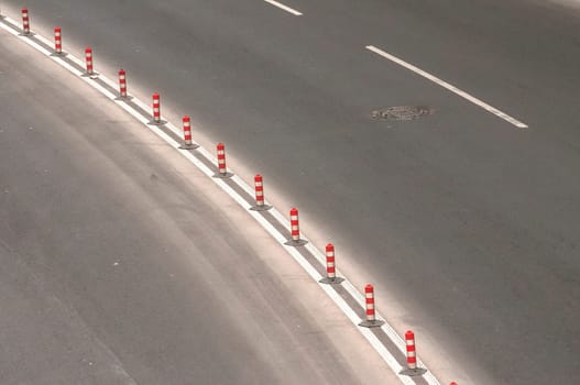 Part of used asphalt roadway with road marking lines