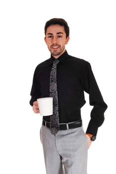 A young businessman standing isolated for white background holding.a coffee cup in his hand..