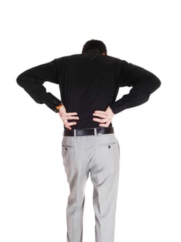 A young businessman standing from the back holding his hands on.his back for heavy back pain, isolated for white background..