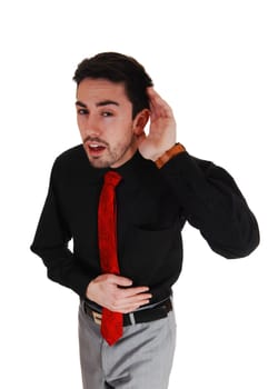 A young businessman holding his hand behind his ear, he can not hear.to good, isolated for white background..