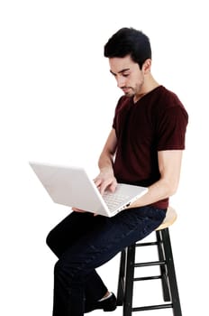 A young man sitting on a chair with his laptop on his lap, isolated on.white background..