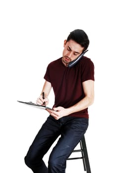 A young man with a phone on his ear and writing on his clipboard,.isolated for white background..