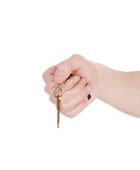 A single male hand holding a house key, isolated on white.background..