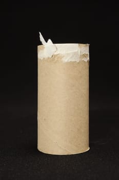 Empty Toilet Rolls Stack Up On a Black Background