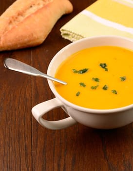 Hokkaido pumpkin cream soup on a kitchen table