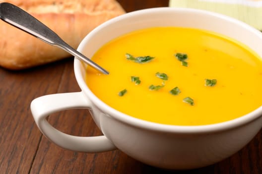 Hokkaido pumpkin cream soup on a kitchen table