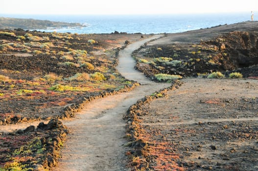 Travel Concept Background - Pathway in the Volcanic Desert Tenerife Canaty Islands Spain