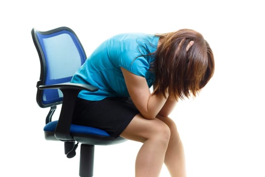 girl in despair on a chair on a white background