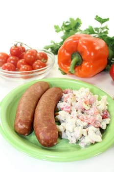Mettenden with pasta salad against a white background