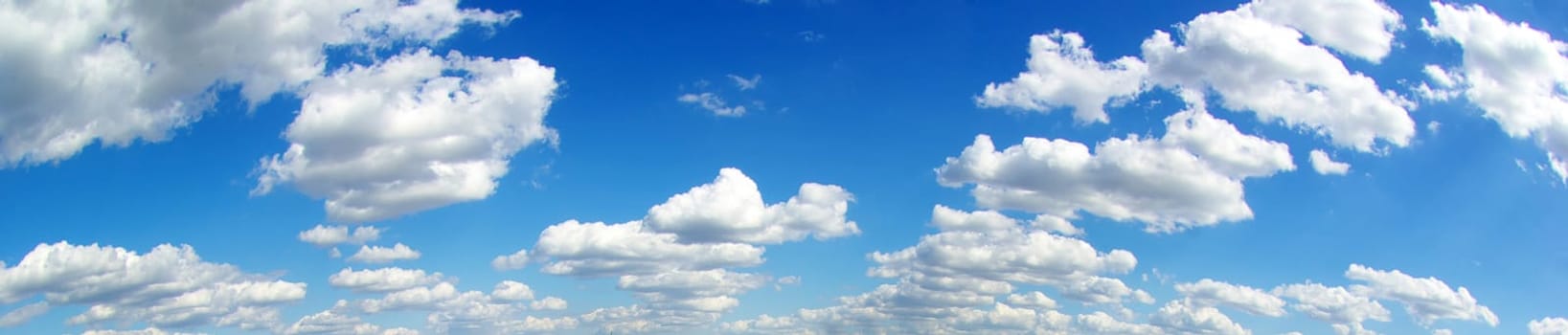 blue sky background with tiny clouds