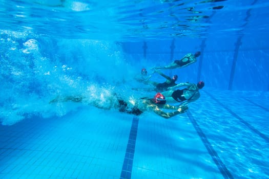 Girls Synchronized underwater swimming water action at national championships