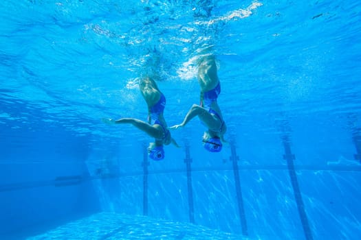 Girls Synchronized underwater swimming water action at national championships