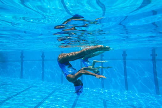 Girls Synchronized underwater swimming water action at national championships
