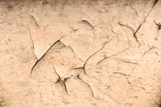Piece of metal sheet covered with cracked paint.